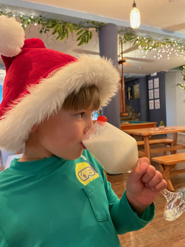 Have lots of fun with a santa hat - christmas travel with kids